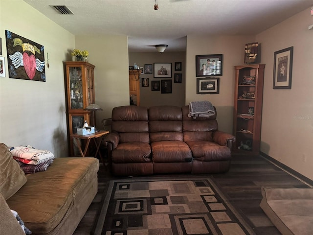living room featuring wood finished floors and baseboards