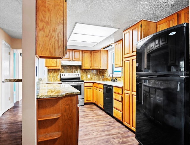 771 Murphy Ave N, Saint Petersburg, FL 33703 - kitchen featuring electric stove, under cabinet range hood, a textured ceiling, dishwasher, and a sink