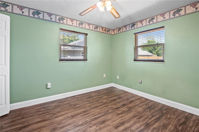771 Murphy Ave N, Saint Petersburg, FL 33703 - spare room with a textured ceiling, healthy amount of natural light, wood finished floors, baseboards, and a ceiling fan