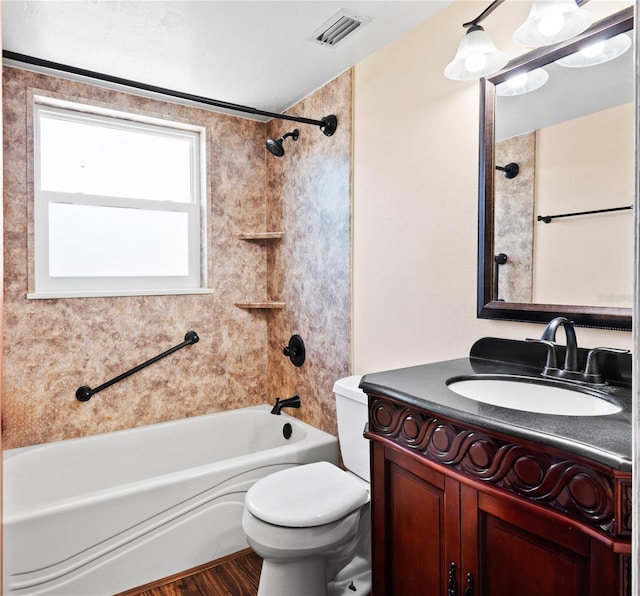 771 Murphy Ave N, Saint Petersburg, FL 33703 - bathroom featuring  shower combination, vanity, toilet, and wood finished floors