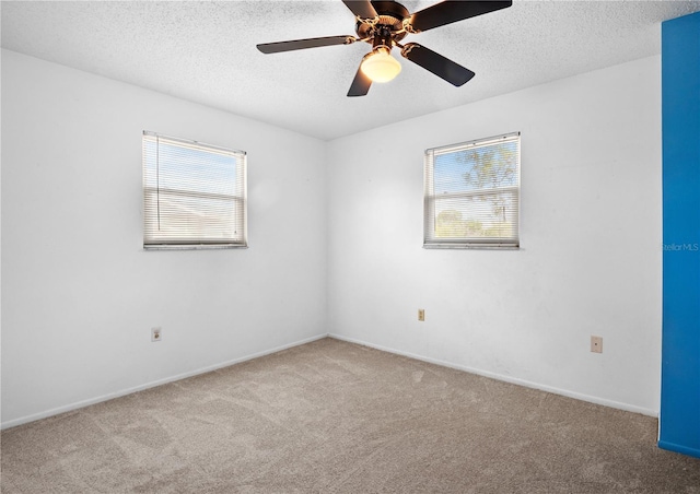 771 Murphy Ave N, Saint Petersburg, FL 33703 - carpeted spare room with a textured ceiling, baseboards, and ceiling fan
