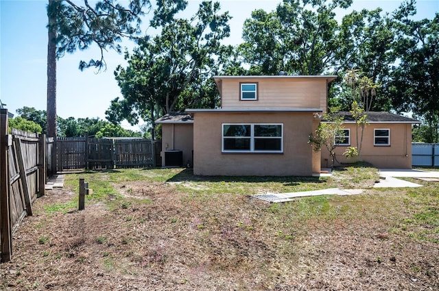 771 Murphy Ave N, Saint Petersburg, FL 33703 - view of front of property with stucco siding, a fenced backyard, and central AC