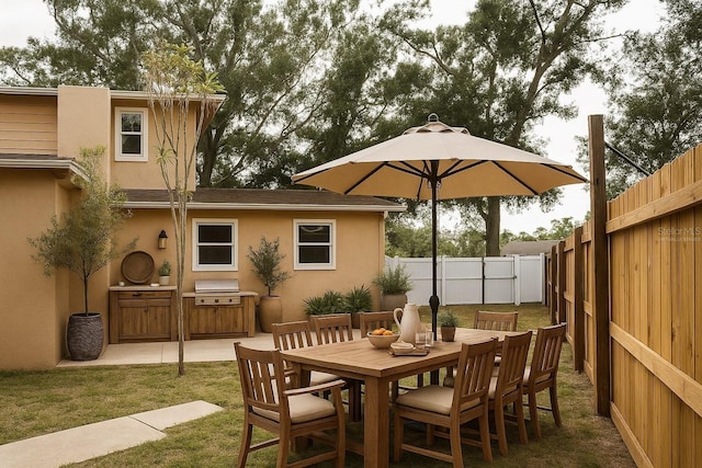 771 Murphy Ave N, Saint Petersburg, FL 33703 - view of patio with an outdoor kitchen and outdoor dining space