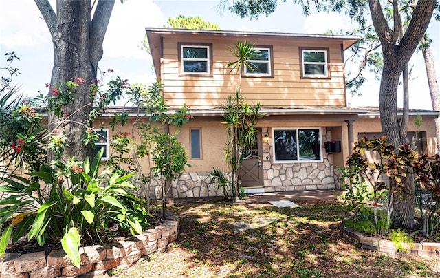 771 Murphy Ave N, Saint Petersburg, FL 33703 - view of front facade with stone siding and stucco siding