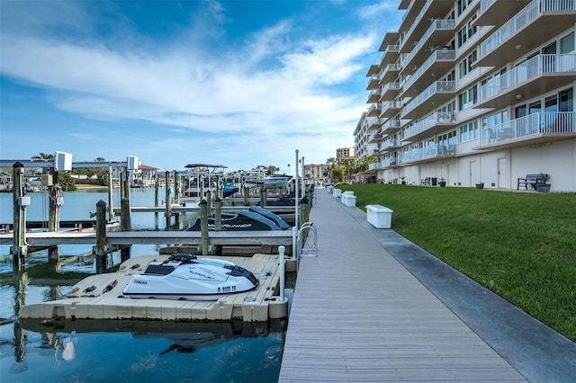 223 Island Way Unit 5D, Clearwater Beach, FL 33767 - dock area with a lawn, boat lift, and a water view