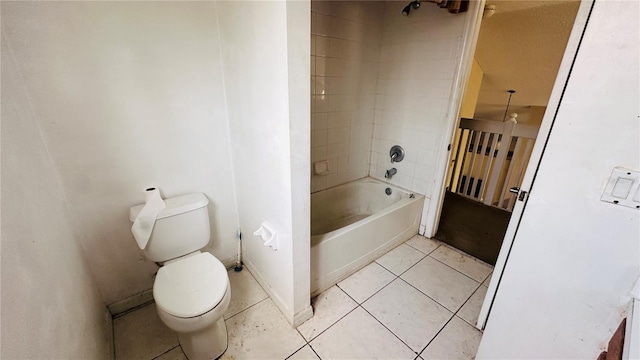 bathroom with shower / bathtub combination, tile patterned flooring, and toilet