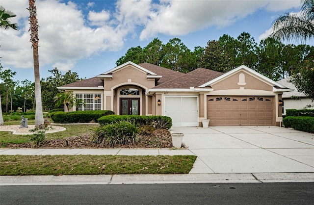 617 Glastonbury Ct, Spring Hill, FL 34609 - ranch-style home with stucco siding, an attached garage, french doors, driveway, and a shingled roof