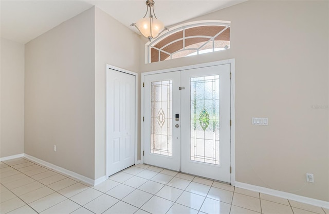 617 Glastonbury Ct, Spring Hill, FL 34609 - foyer with french doors, baseboards, healthy amount of natural light, and light tile patterned floors