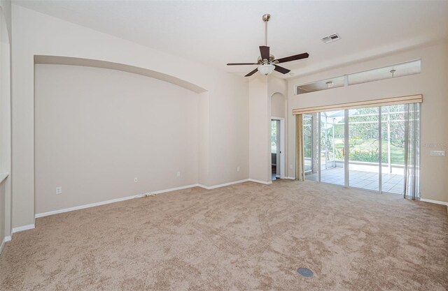 617 Glastonbury Ct, Spring Hill, FL 34609 - empty room with arched walkways, carpet flooring, ceiling fan, and baseboards