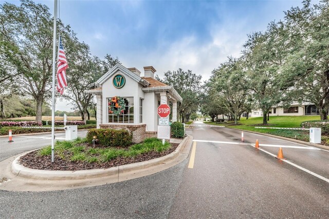 617 Glastonbury Ct, Spring Hill, FL 34609 - view of asphalt street with curbs and traffic signs