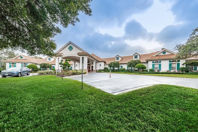 617 Glastonbury Ct, Spring Hill, FL 34609 - surrounding community featuring a yard