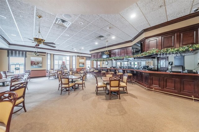 617 Glastonbury Ct, Spring Hill, FL 34609 - dining space featuring light colored carpet, ornamental molding, a ceiling fan, and recessed lighting