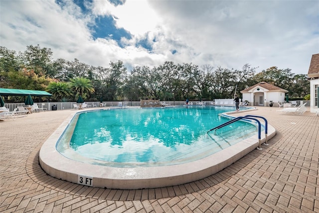 617 Glastonbury Ct, Spring Hill, FL 34609 - community pool with a patio area and fence