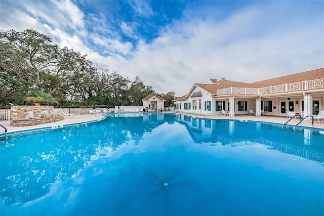 617 Glastonbury Ct, Spring Hill, FL 34609 - community pool with a patio area and fence