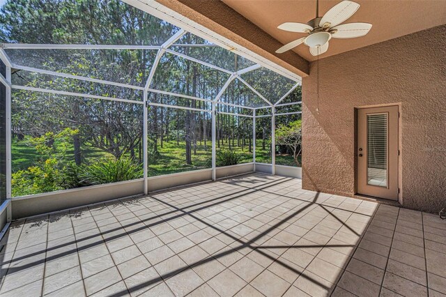 617 Glastonbury Ct, Spring Hill, FL 34609 - unfurnished sunroom featuring a ceiling fan