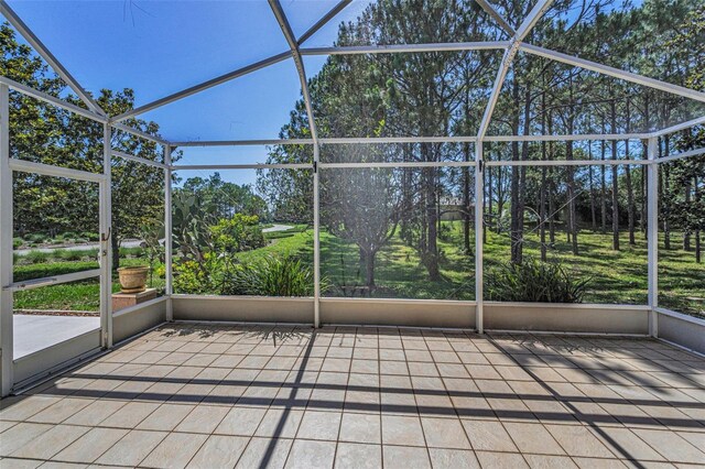 617 Glastonbury Ct, Spring Hill, FL 34609 - unfurnished sunroom with view of wooded area