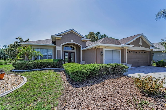 617 Glastonbury Ct, Spring Hill, FL 34609 - ranch-style home featuring french doors, a garage, driveway, and stucco siding