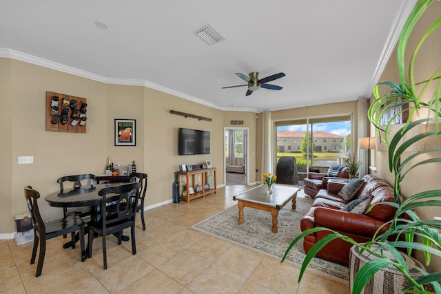 living area featuring visible vents, baseboards, ceiling fan, and light tile patterned floors