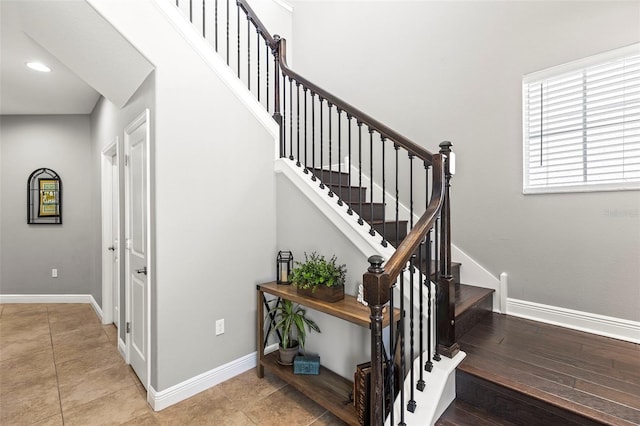 staircase with baseboards and recessed lighting