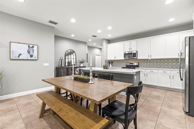 dining area featuring visible vents, recessed lighting, baseboards, and light tile patterned floors