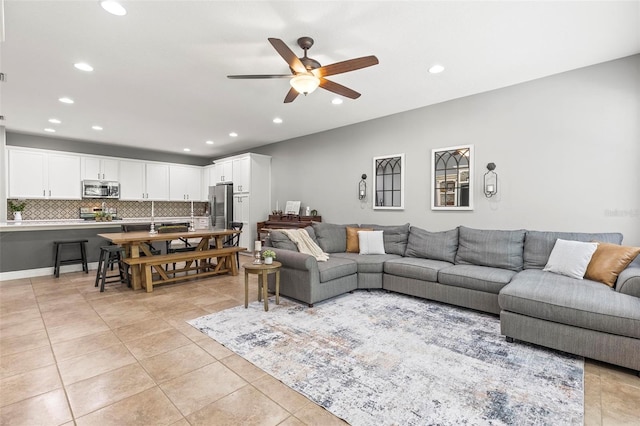 living area featuring recessed lighting, ceiling fan, and light tile patterned flooring