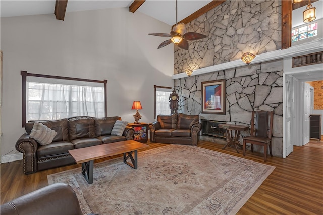 2014 E Broad St, Tampa, FL 33610 - living area with wood finished floors, a ceiling fan, beam ceiling, and high vaulted ceiling