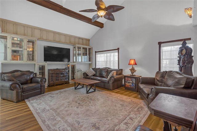 2014 E Broad St, Tampa, FL 33610 - living room featuring a ceiling fan, beam ceiling, wood finished floors, and high vaulted ceiling