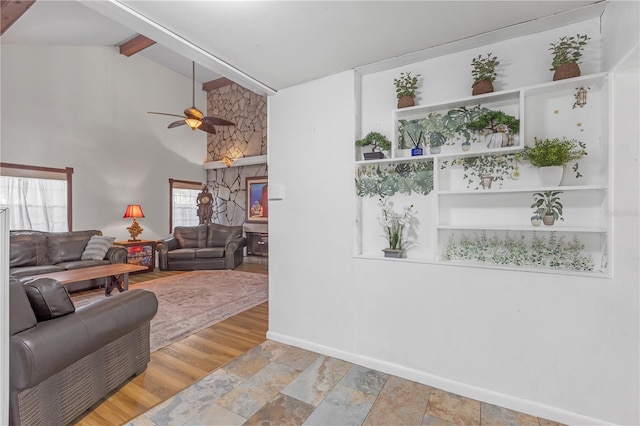 2014 E Broad St, Tampa, FL 33610 - living room with baseboards, a ceiling fan, beam ceiling, and high vaulted ceiling