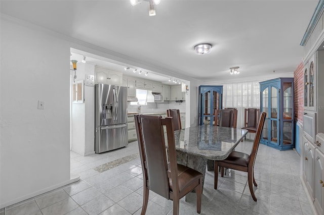 2014 E Broad St, Tampa, FL 33610 - dining room with baseboards, ornamental molding, french doors, and light tile patterned flooring