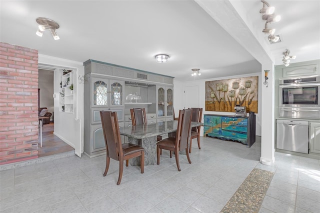 2014 E Broad St, Tampa, FL 33610 - dining area featuring visible vents, baseboards, and light tile patterned floors