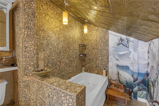 2014 E Broad St, Tampa, FL 33610 - bathroom with a jetted tub and an ornate ceiling