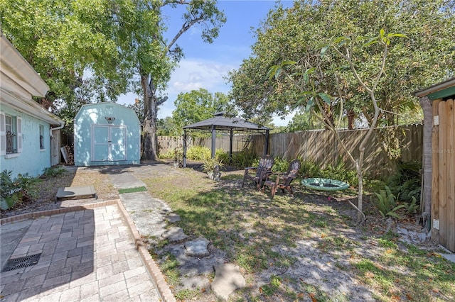 2014 E Broad St, Tampa, FL 33610 - view of yard featuring an outdoor structure, a gazebo, a shed, and a fenced backyard