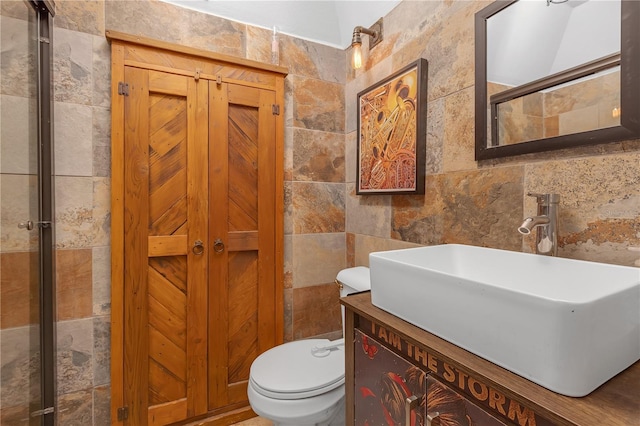 2014 E Broad St, Tampa, FL 33610 - bathroom with vanity, a tile shower, toilet, and tile walls
