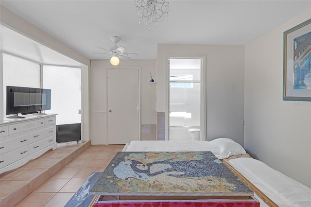 2014 E Broad St, Tampa, FL 33610 - bedroom featuring light tile patterned flooring, ceiling fan, and ensuite bath