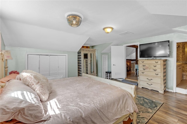 2014 E Broad St, Tampa, FL 33610 - bedroom featuring vaulted ceiling, wood finished floors, visible vents, and a closet