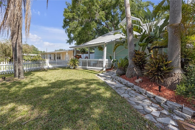 2014 E Broad St, Tampa, FL 33610 - view of yard featuring fence and covered porch