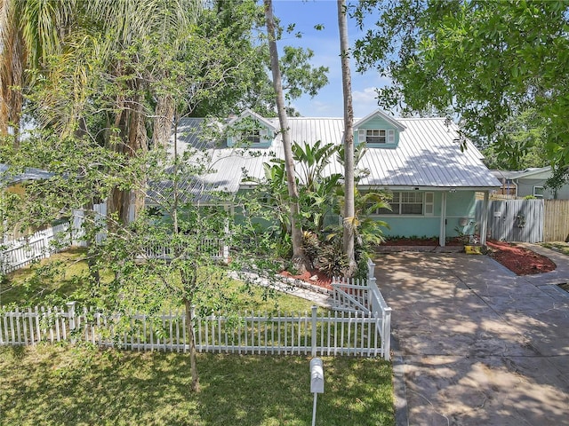 2014 E Broad St, Tampa, FL 33610 - view of front of home with driveway, metal roof, and fence private yard