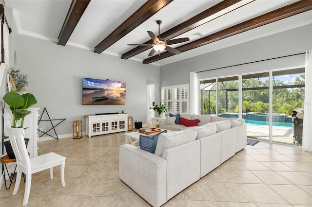 living room featuring visible vents, beamed ceiling, ceiling fan, arched walkways, and light tile patterned floors