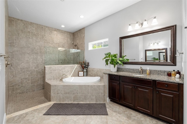 full bath with a relaxing tiled tub, a walk in shower, vanity, tile patterned floors, and recessed lighting