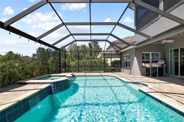 view of pool with a patio, a ceiling fan, a lanai, and a pool with connected hot tub