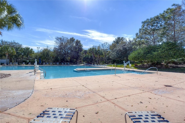 pool with a patio area