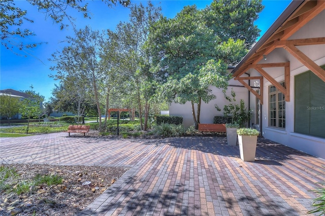 wooden terrace featuring a patio