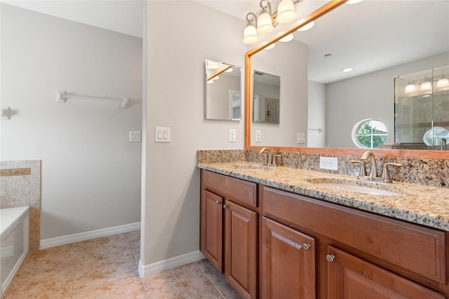 full bath with a garden tub, baseboards, a sink, and double vanity