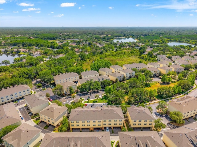 birds eye view of property with a residential view and a water view