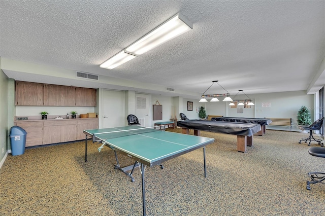 1 Key Capri Unit 608E, Treasure Island, FL 33706 - playroom featuring billiards and a textured ceiling