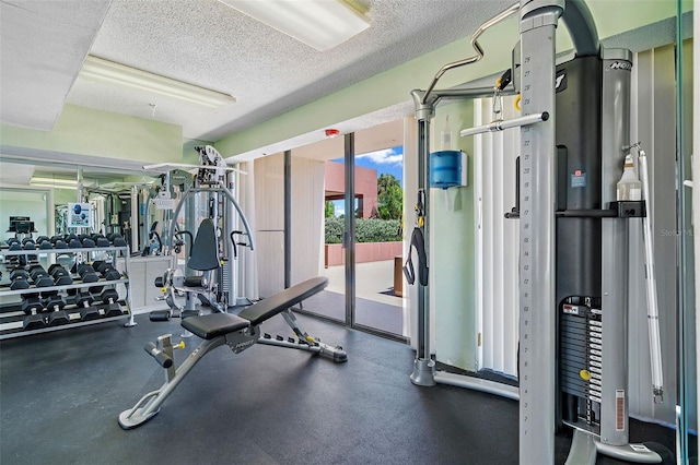 1 Key Capri Unit 608E, Treasure Island, FL 33706 - workout area with a textured ceiling