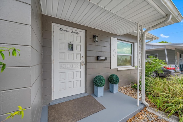 doorway to property featuring a porch