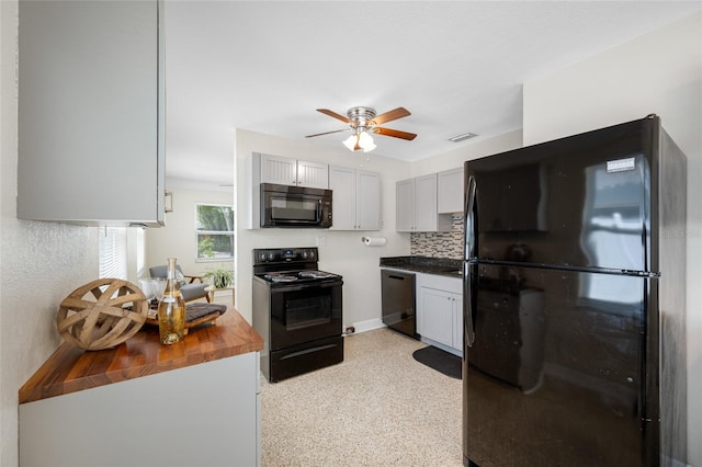 kitchen featuring light speckled floor, tasteful backsplash, ceiling fan, wooden counters, and black appliances
