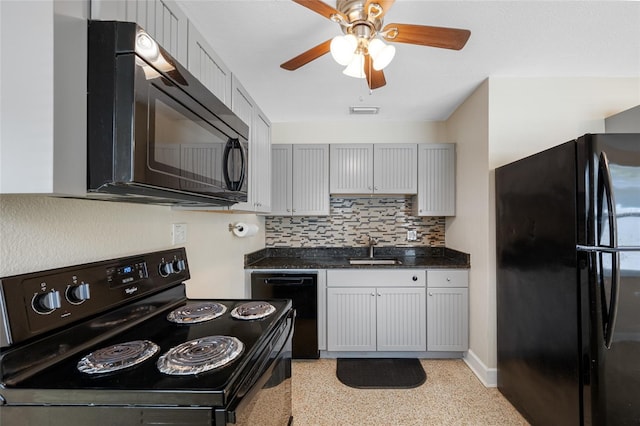 kitchen with a sink, light speckled floor, tasteful backsplash, a ceiling fan, and black appliances
