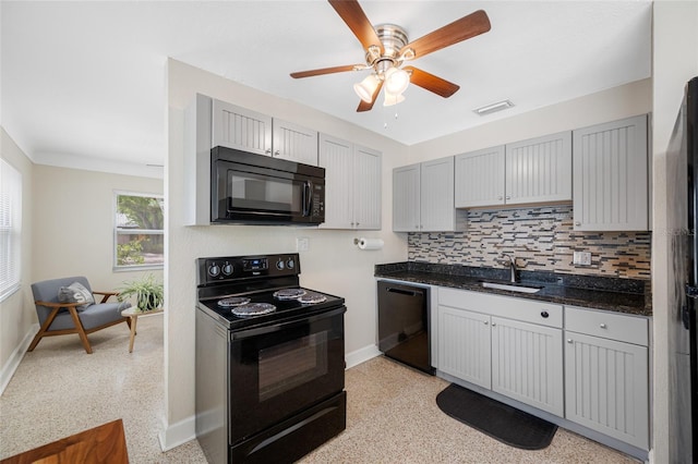 kitchen featuring a sink, black appliances, decorative backsplash, ceiling fan, and baseboards